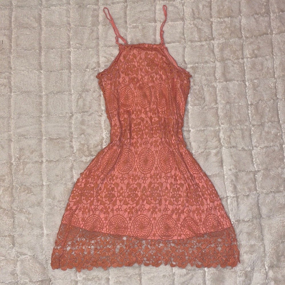 Blush pink lace halter dress. Adjustable straps and a size small